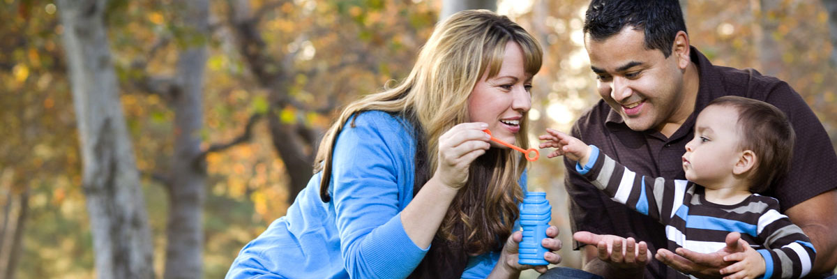 Family having fun blowing bubbles